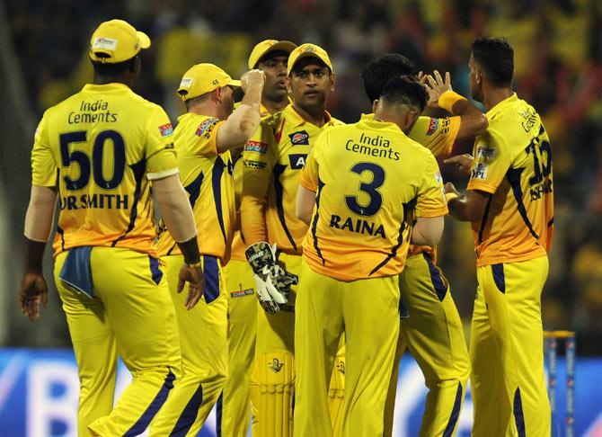 Chennai Super Kings players celebrate a dismissal