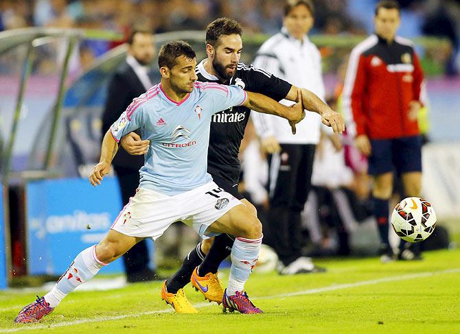 Celta Vigo's Jonny Castro (left) and Real Madrid's Daniel Carvajal vie for possession