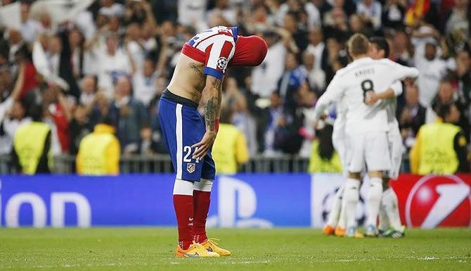 Atletico Madrid's Jose Maria Gimenez is dejected at the end of their Champions League second leg quarter-final against Real Madrid on April 22