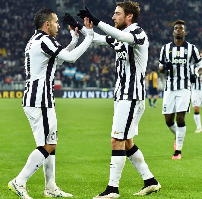 Carlos Tevez (left) of Juventus FC celebratesa with teammate Claudio Marchisio