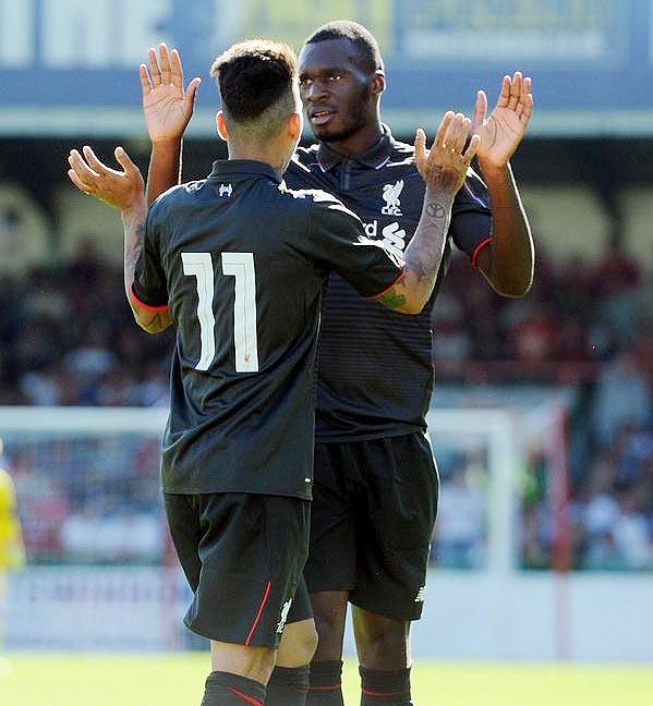 Christian Benteke celebrates a goal with Firmino