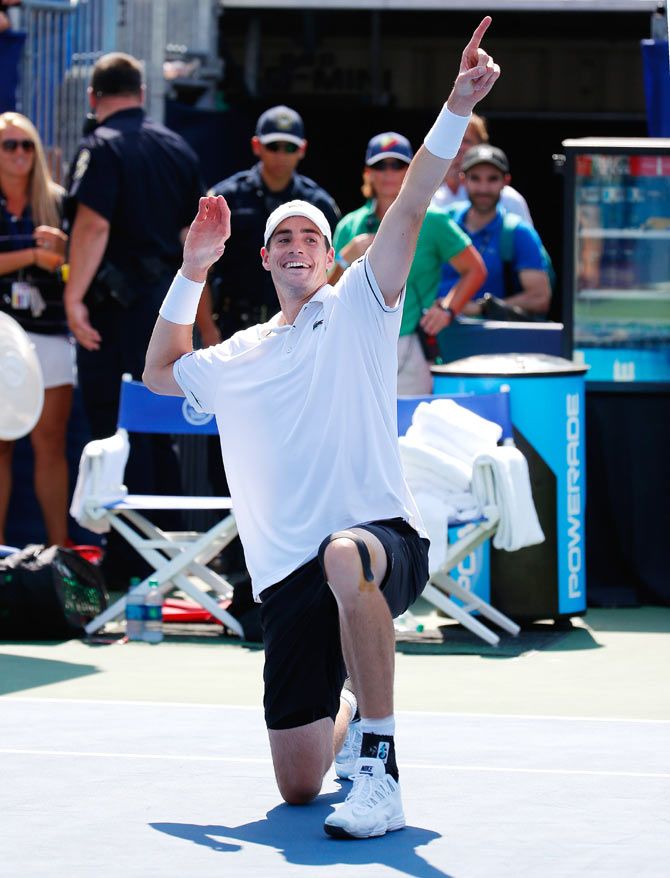 American John Isner reacts after defeating Cypriot Marcos Baghdatis during the BB&T Atlanta Open Final at Atlantic Station in Atlanta, Georgia, on Sunday