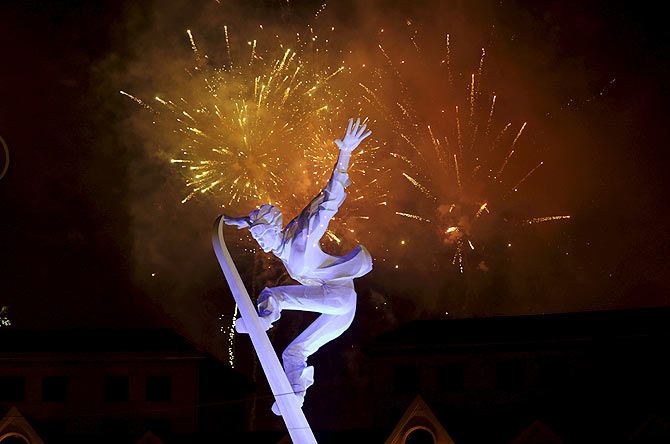 Fireworks explode behind a snowboarding sculpture to celebrate Beijing being chosen to host the 2022 Winter Olympics, in Chongli county of Zhangjiakou, jointly bidding to host the 2022 Winter Olympic Games with capital Beijing, July 31, 2015. Beijing was chosen by the International Olympic Committee (IOC) to host the 2022 Winter Olympics on Friday, becoming the first city to be awarded both summer and winter Games