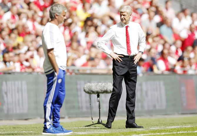 Arsenal manager Arsene Wenger and Chelsea manager Jose Mourinho (left) during the Community Shield match at Wembley stadium on Sunday