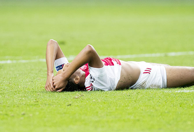 Ajax Amsterdam's Jairo Riedewald reacts after a goal by Rapid Vienna during their Champions League third qualifying round match in the Amsterdam ArenA stadium on Tuesday