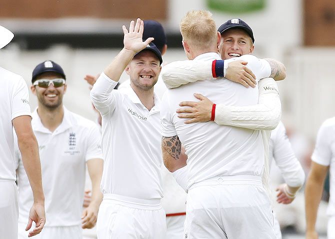 England's Ben Stokes celebrates with Joe Root after the wicket of Australia's Mitchell Starc