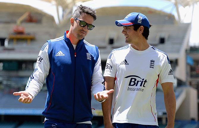 Kevin Pietersen speaks with England captain Alastair Cook