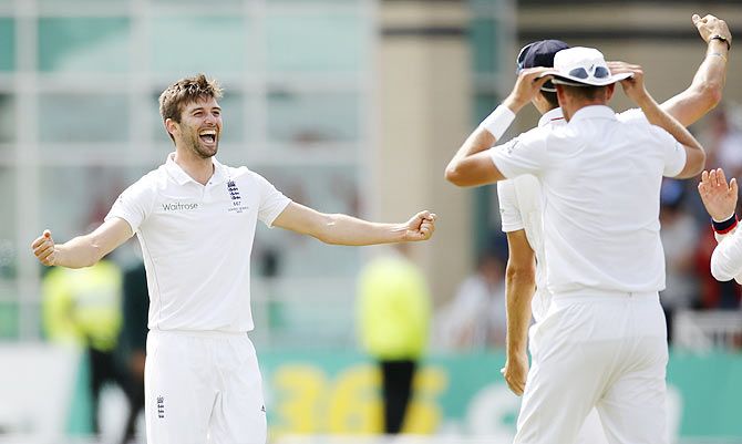 England's Mark Wood celebrates the wicket of Australia's Nathan Lyon 
