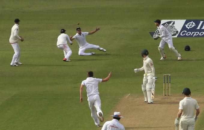 Michael Clarke of Australia edges and is juggled by Alastair Cook before being caught by Ian Bell off the bowling of Mark Wood on Friday