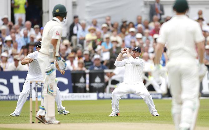 England's Ian Bell takes a catch to dismiss Australia's Mitchell Starc