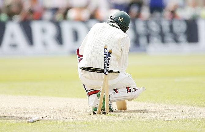 Australia's Nathan Lyon is being bowled out by England's Mark Wood 