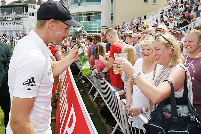 England's Joe Root celebrates winning the Ashes with his mother