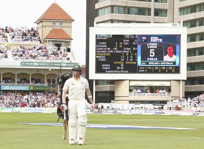 Australia's Steve Smith looks walks back to the pavillion after being dismissed by England's Stuart Broad in their second innings on Friday