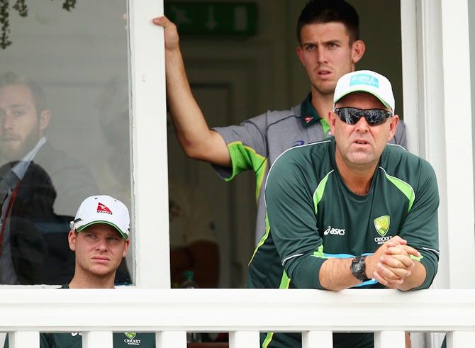 Australian coach Darren Lehmann and Steve Smith watch as wickets tumble at Trent Bridge on Saturday