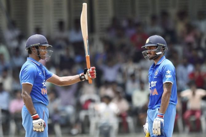 Mayank Agarwal celebrates after completing his century as Manish Pandey looks on