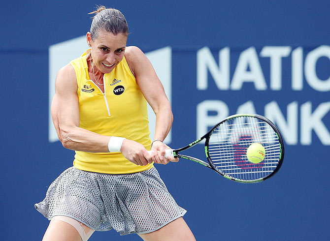 Italy's Flavia Pennetta plays a forehand against USA's Serena Williams