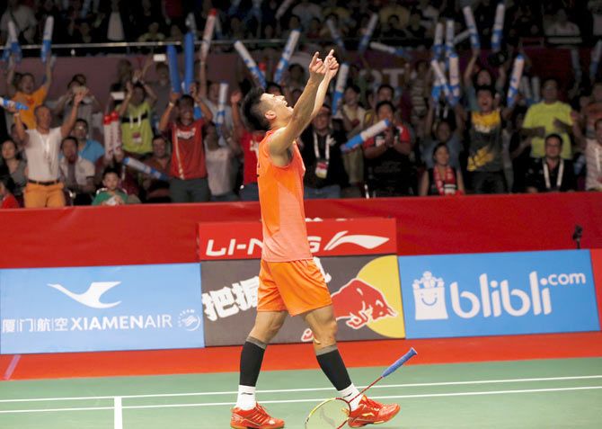China's Chen Long reacts after beating Malaysia's Lee Chong Wei during their men's singles final match at the World Championships in Jakarta on Sunday