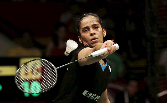India's Saina Nehwal returns a shot to Spain's Carolina Marin
