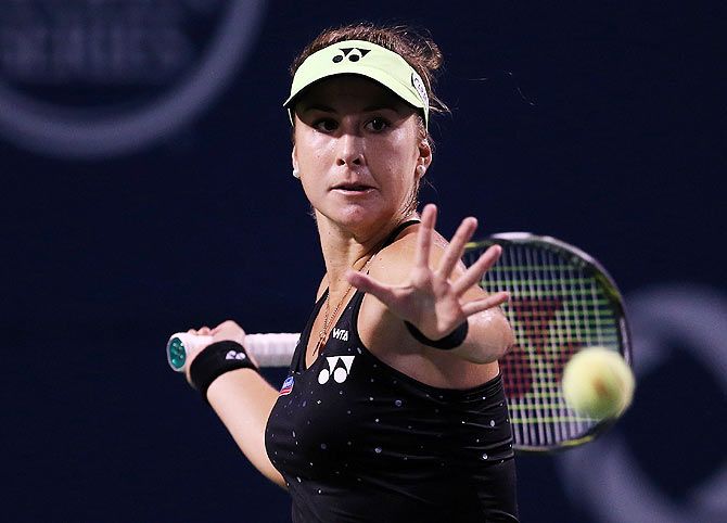 Belinda Bencic plays a shot against Serena Williams