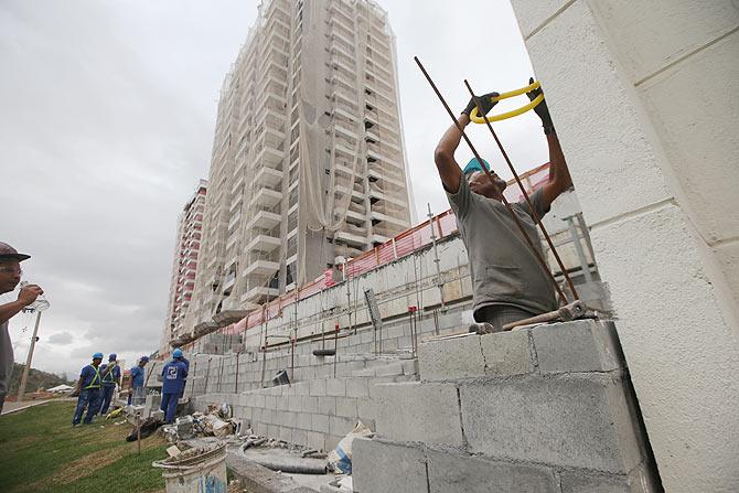 Construction progress takes place during a tour of the Ilha Pura housing complex, the future site of the Athletes' Village for the Rio 2016 Olympic Games, in Rio de Janeiro, Brazil