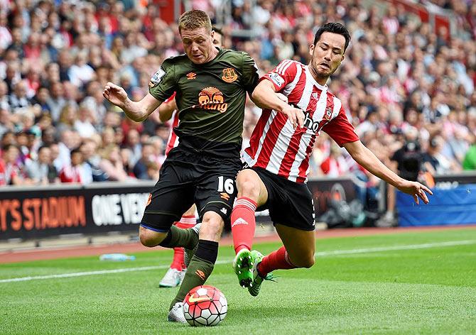 Everton's James McCarthy vies for the ball with Southampton's Maya Yoshida