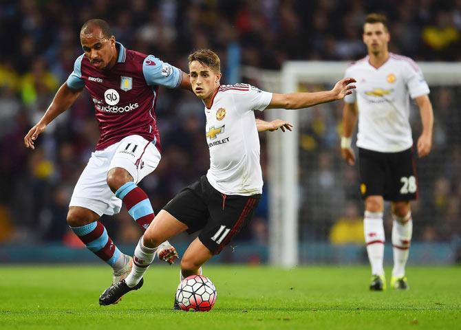 Aston Villa's Gabriel Agbonlahor (left) challenges Manchester United's Adnan Januzaj during their Barclays English Premier League match in Birmingham on Friday