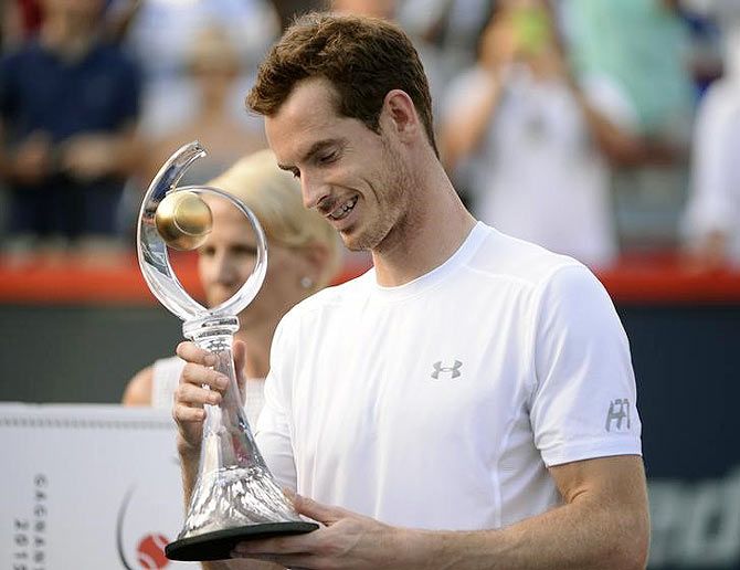 Great Britain's Andy Murray with the Rogers Cup trophy on Sunday