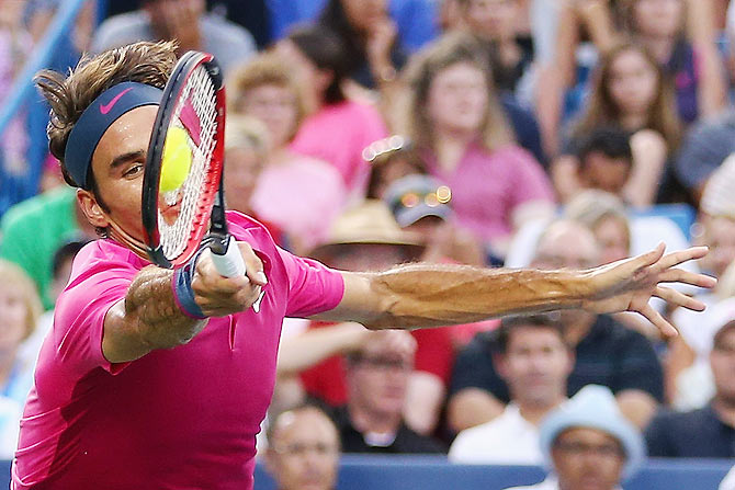 Switzerland's Roger Federer returns a forehand to Spain's Roberto Bautista Agut during the Western & Southern Open at the Lidler Family Tennis Center in Cincinnati on Tuesday