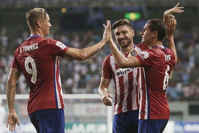 Atletico Madrid players celebrate a goal