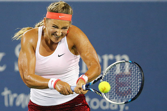 Belarus' Victoria Azarenka returns a shot to Denmark's Caroline Wozniack