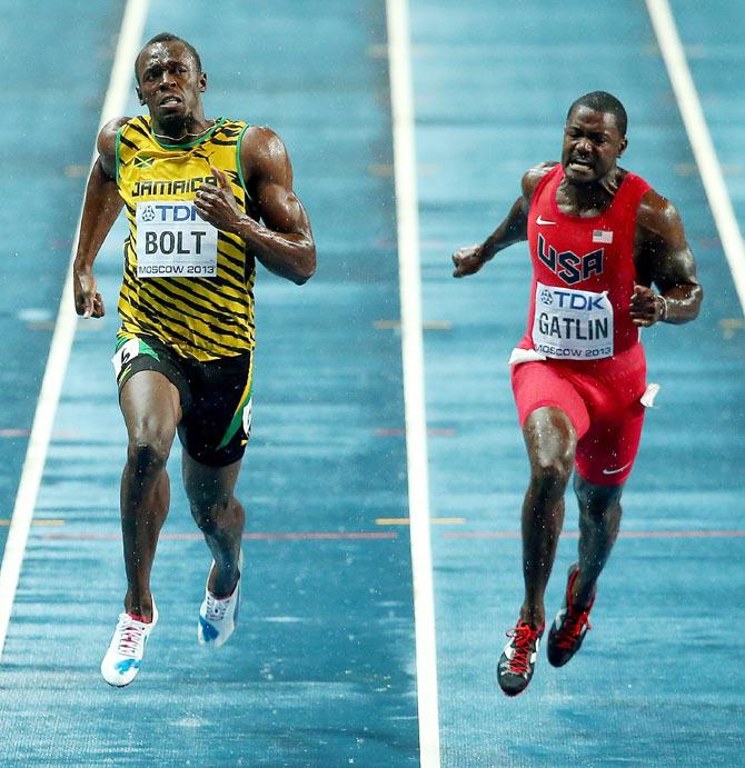 Usain Bolt crosses the line to win gold ahead of Justin Gatlin in the Men's 100 metres Final at of the 14th IAAF World Athletics Championships at Luzhniki Stadium in Moscow on August 11, 2013