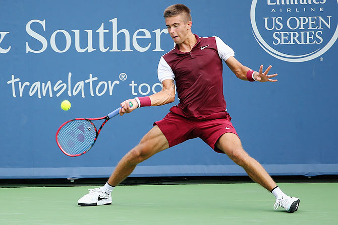 Croatia's Borna Coric plays a forehand against Switzerland's Stanislas Wawrinka