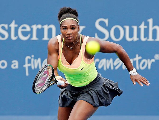Serena Williams (USA) charges the net to return a shot against Tsventana Pironkova