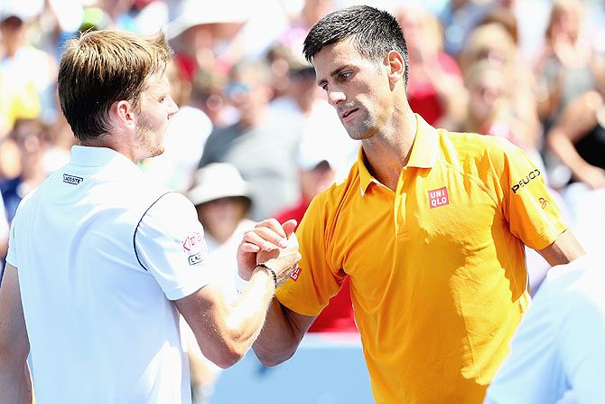 Serbia's Novak Djokovic shakes hands with Belarus' David Goffin after their match