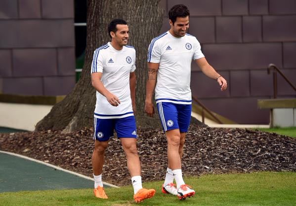 Chelsea's new signing Pedro and teammate Cesc Fabregas head out for a training session on Friday
