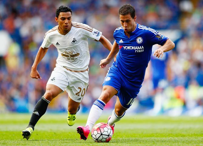 Chelsea's Eden Hazard and Swansea City's Jefferson Montero compete for the ball