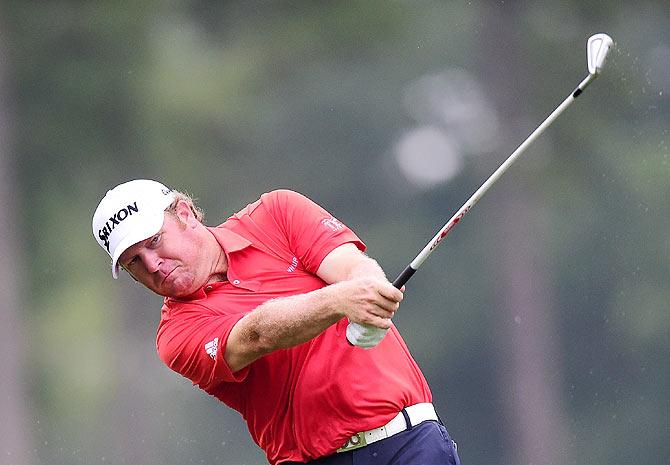 William McGirt plays his second shot from the fairway on the 1st hole