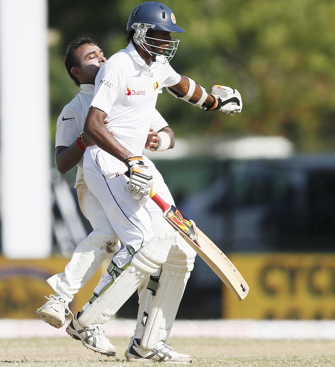 India's Amit Mishra, left, collides with Sri Lanka's Tharindu Kaushal