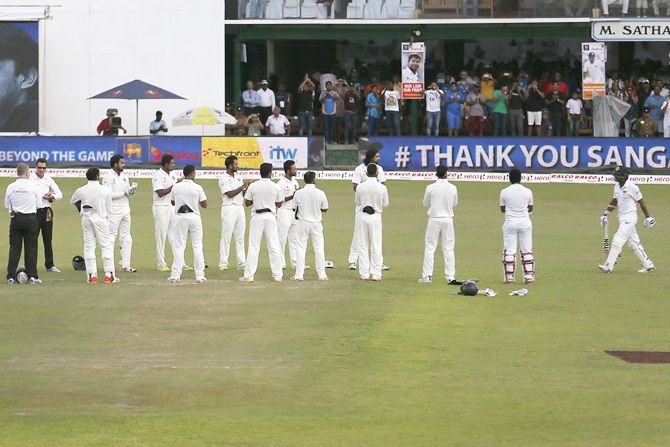 Indian cricket team members applaud Sri Lanka's Kumar Sangakkara 