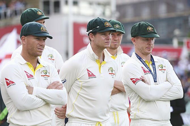 Australia players David Warner, Steve Smith and Chris Rogers look on during the presentaion on Day 4 of the 5th Ashes Test at The Kia Oval in London on Sunday