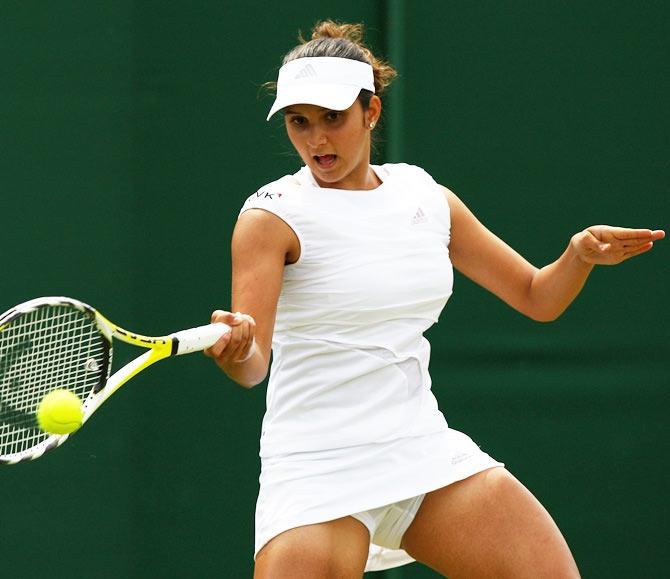 Sania Mirza plays a forehand