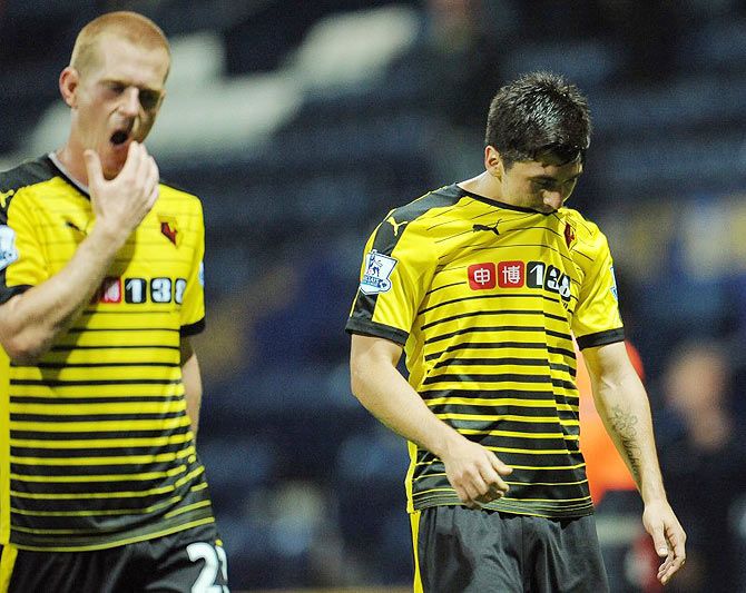Watford's Ben Watson (left) and Fernando Forestieri walk off dejected at full time after their FA Cup match against Preston North End during their FA Cup second round match at Deepdale on Tuesday