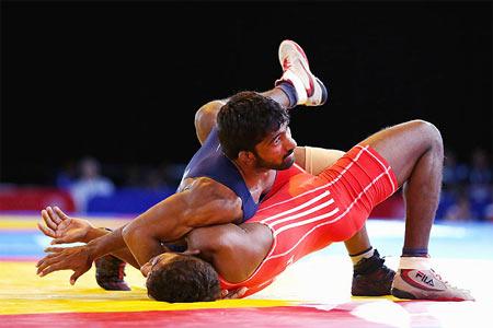 Yogeshwar Dutt of India defeats Chamara Perera of Sri Lanka in the semi-final of the 65kg Men's Wrestling at the Glasgow 2014 Commonwealth Games 