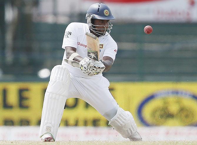 Sri Lanka's Rangana Herath hits a boundary