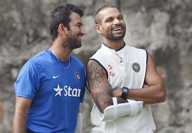 Shikhar Dhawan and Cheteshwar Pujara during a practice session in New Delhi  