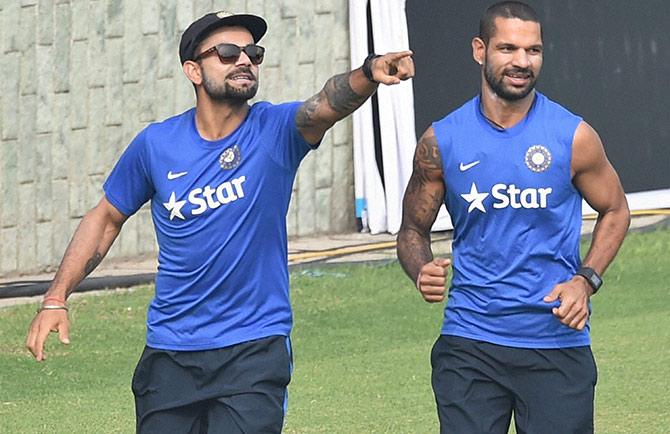 India captain Virat Kohli with Shikhar Dhawan during a practice sesion in New Delhi 