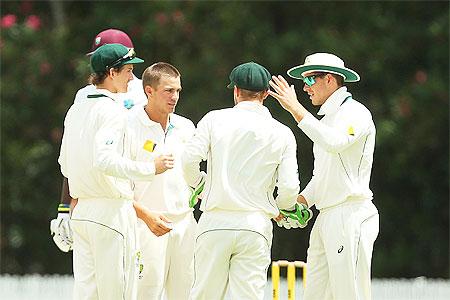 CA XI's Cameron Boyce celebrates the dismissal of West Indies' Kemar Roach during the tour match at Allan Border Field in Brisbane on Saturday