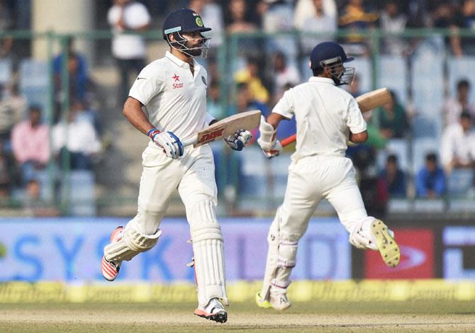 India's Virat Kholi (left) and Ajinkya Rahane take a run during the 3rd day of the fourth Test match against South Africa in New Delhi on Saturday