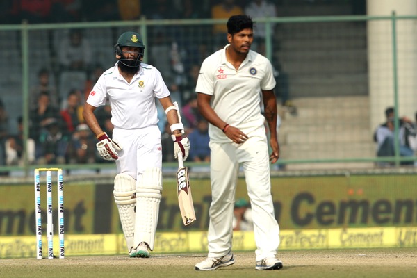 Umesh Yadav of India walks back after serving South African captain Hashim Amla with a bouncer 