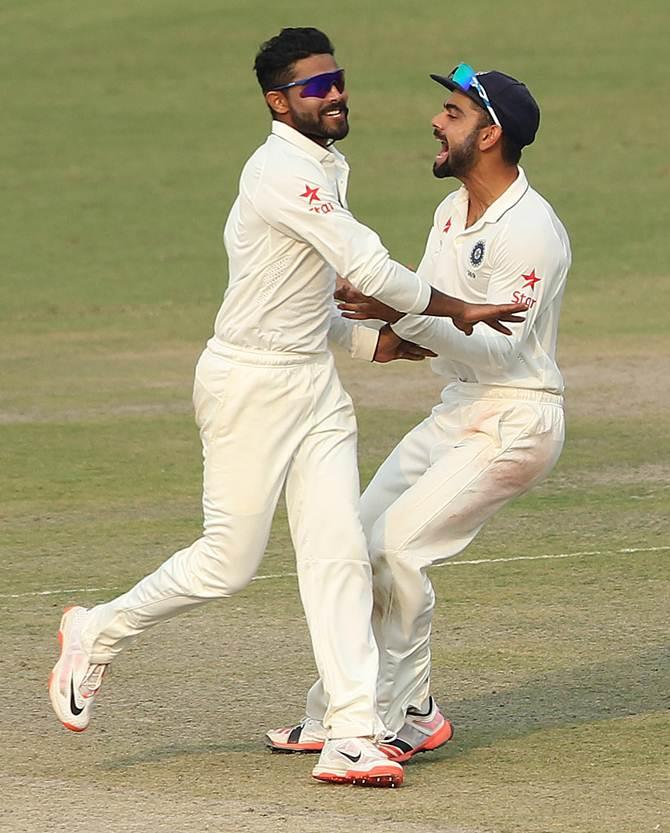 Ravindra Jadeja is congratulated by captain Virat Kohli after picking a wicket